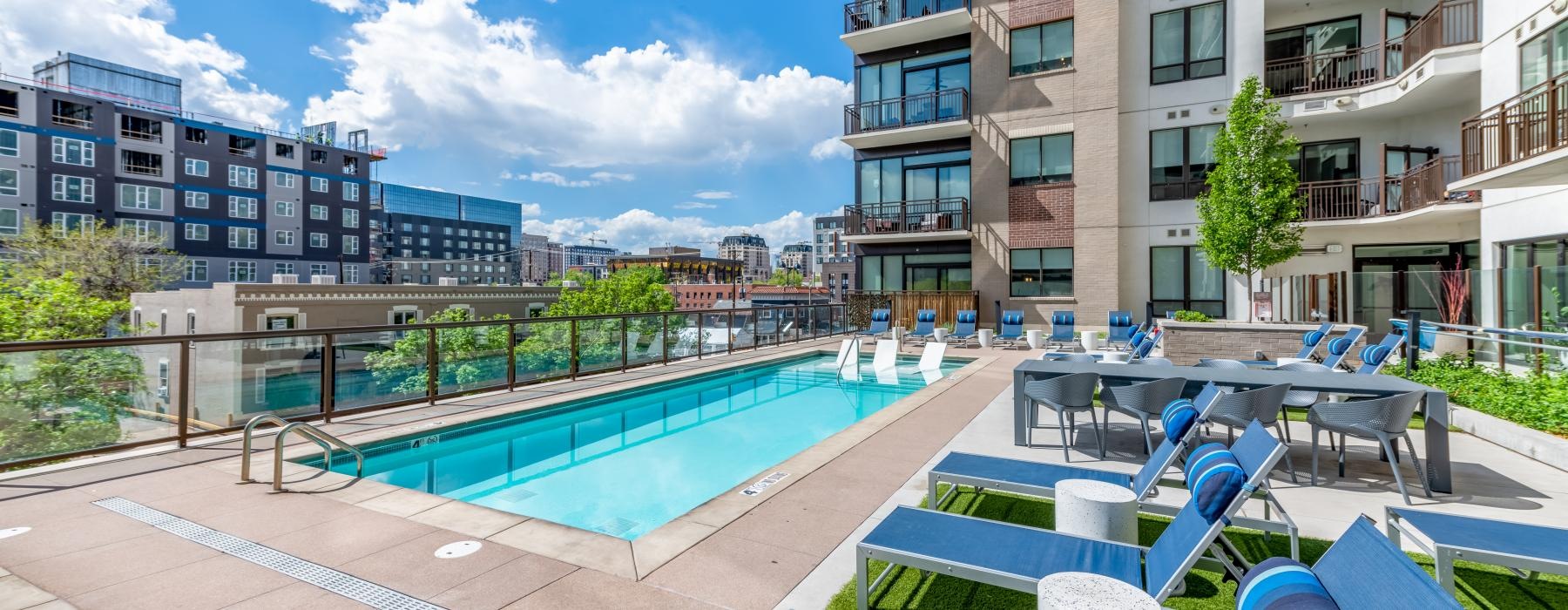 a pool with chairs around it