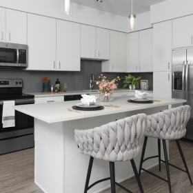 a kitchen with white cabinets