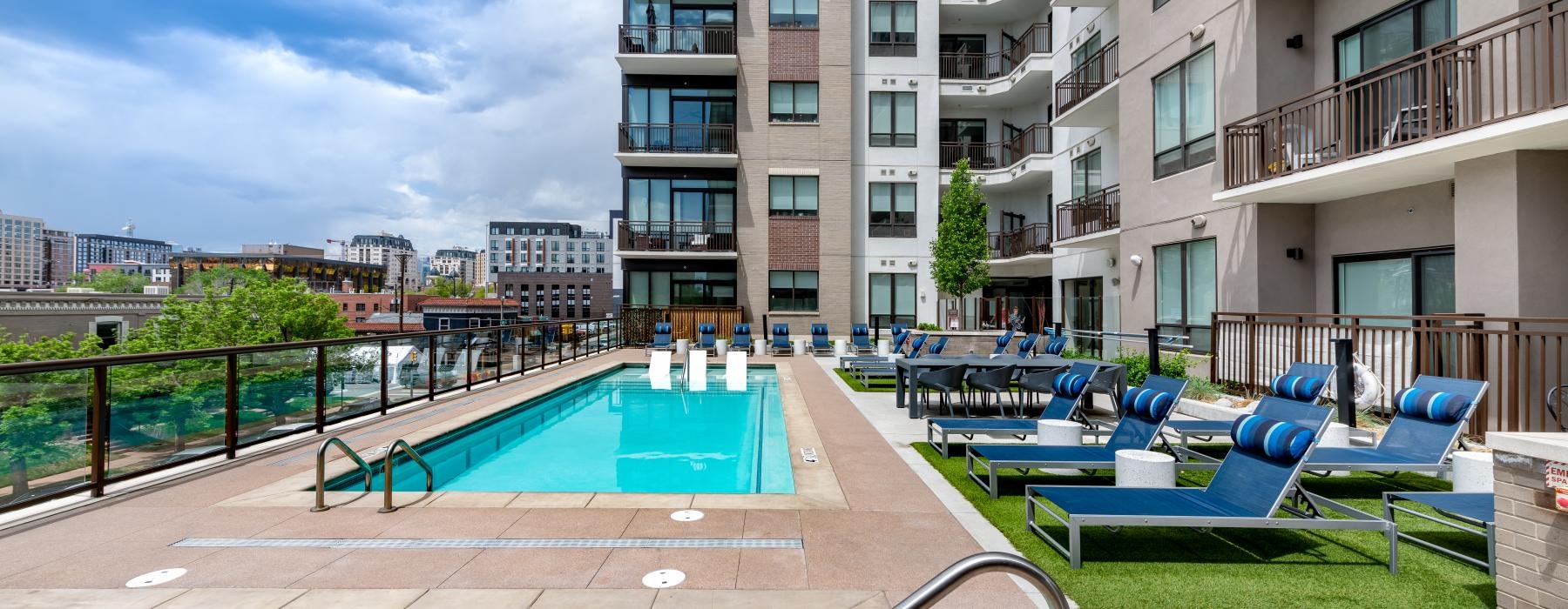 a pool with chairs around it