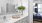 a bathroom with a sink and a bed