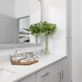 a bathroom with a sink and a bed