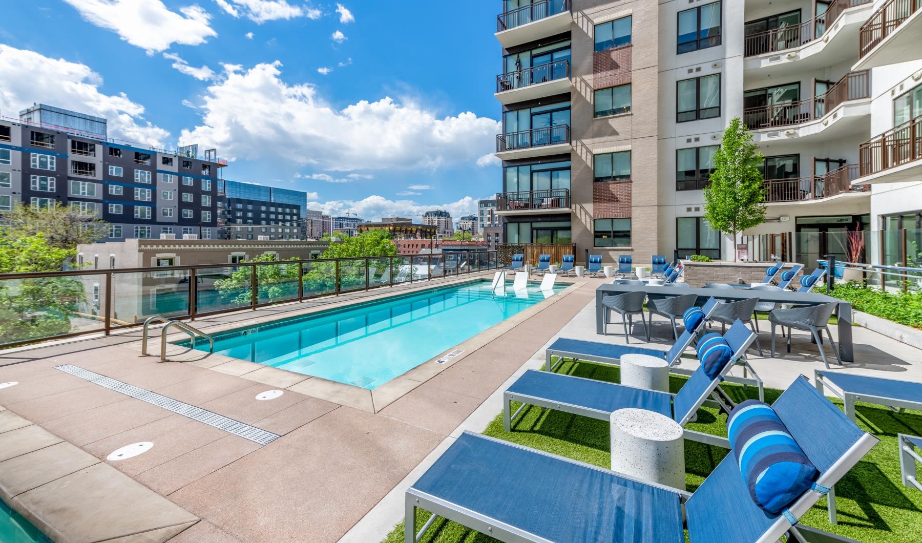 a pool with chairs around it