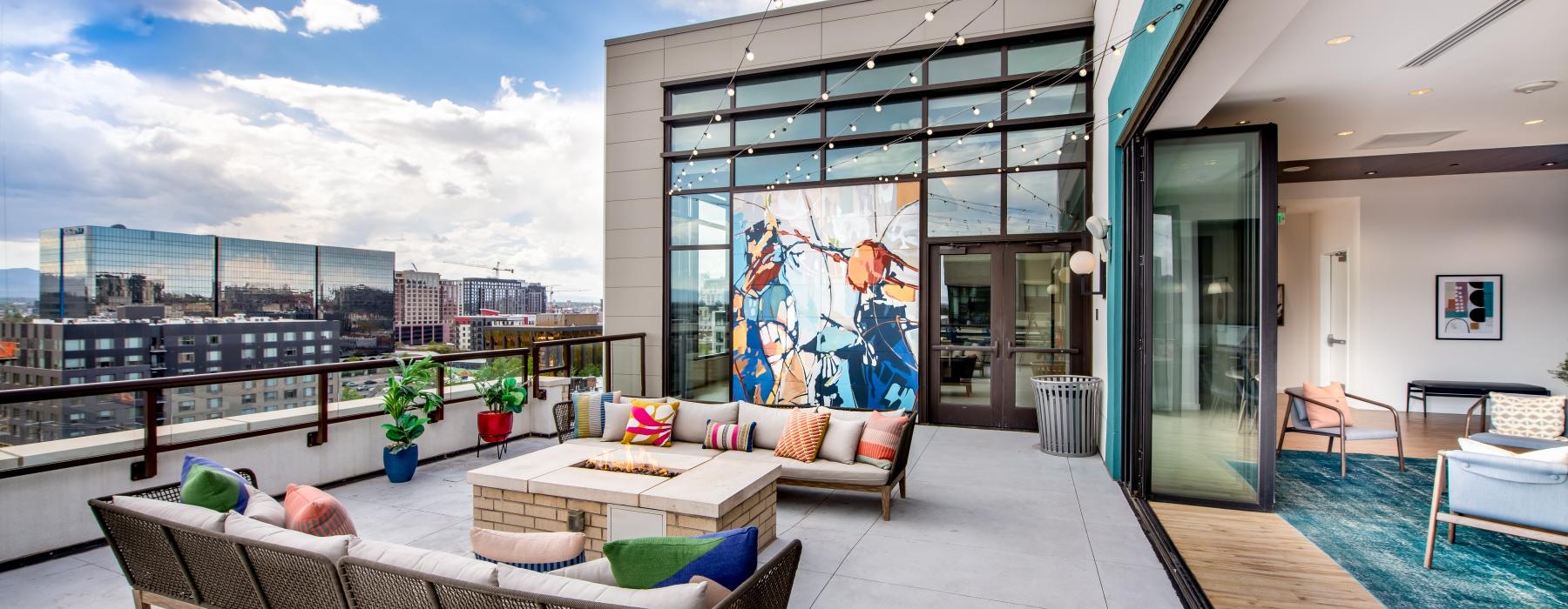 a patio with a couch and chairs
