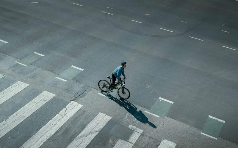 Find your perfect fit at Aspire 7th & Grant a person riding a bicycle on a street